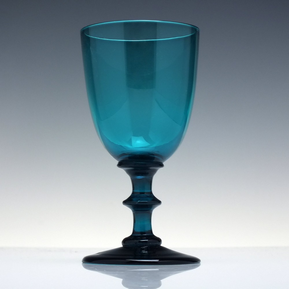 A pair of Georgian teal blue hand-blown glass wine goblets featuring knopped stems and circular bases. View III