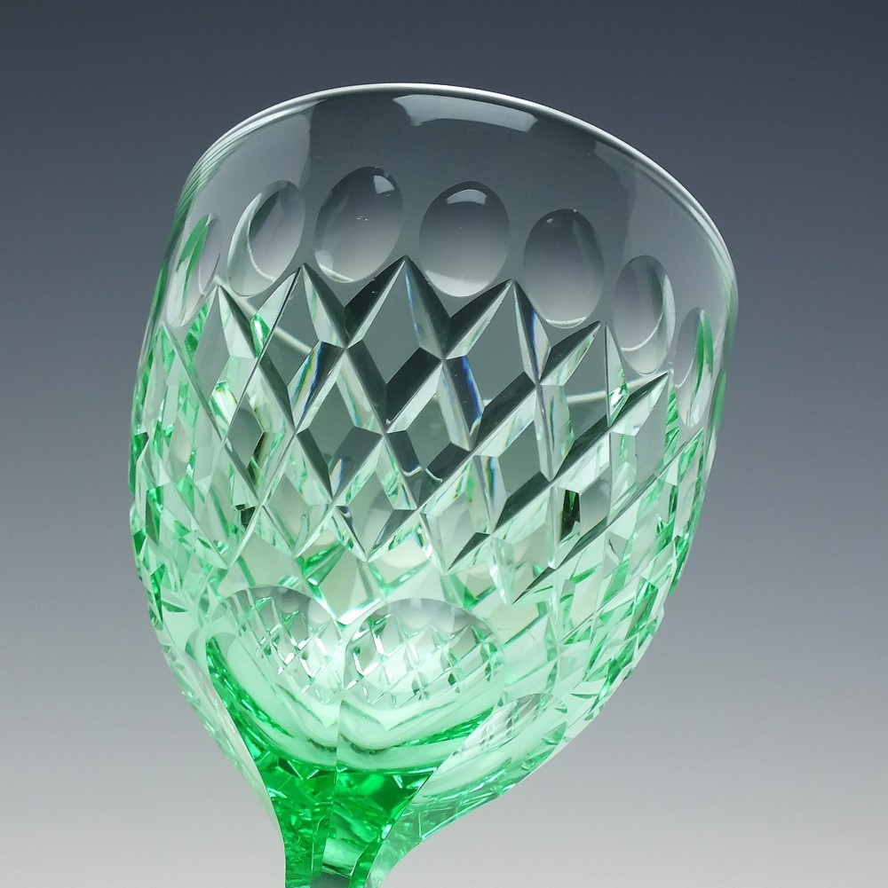 A set of six Victorian light green vaseline glass wine goblets featuring diamond-cut bowls and faceted stems. View VII