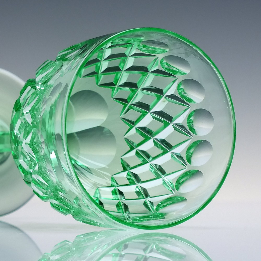 A set of six Victorian light green vaseline glass wine goblets featuring diamond-cut bowls and faceted stems. View IX