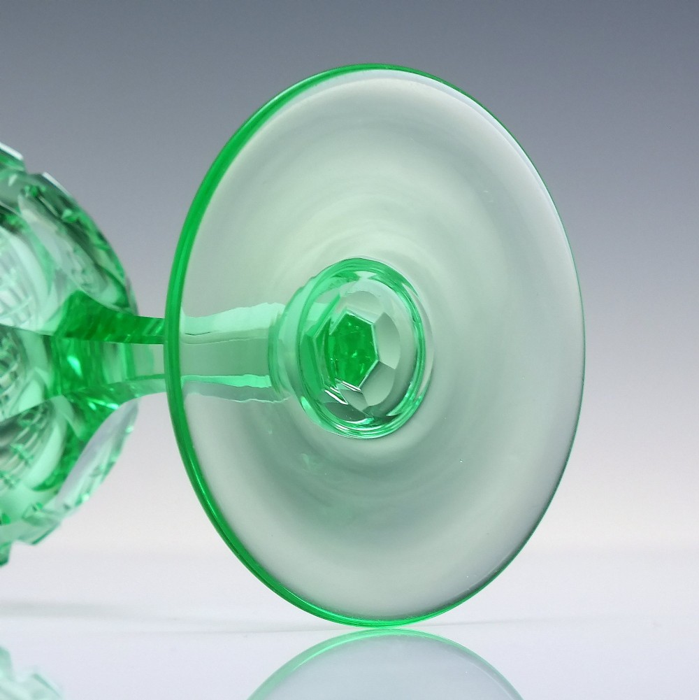 A set of six Victorian light green vaseline glass wine goblets featuring diamond-cut bowls and faceted stems. View X