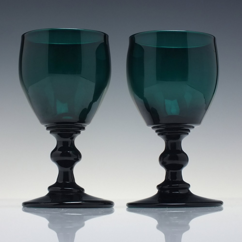 A pair of deep emerald green Georgian hand-blown wine glasses featuring curved bucket bowls, knopped stems, and circular flat bases. View II