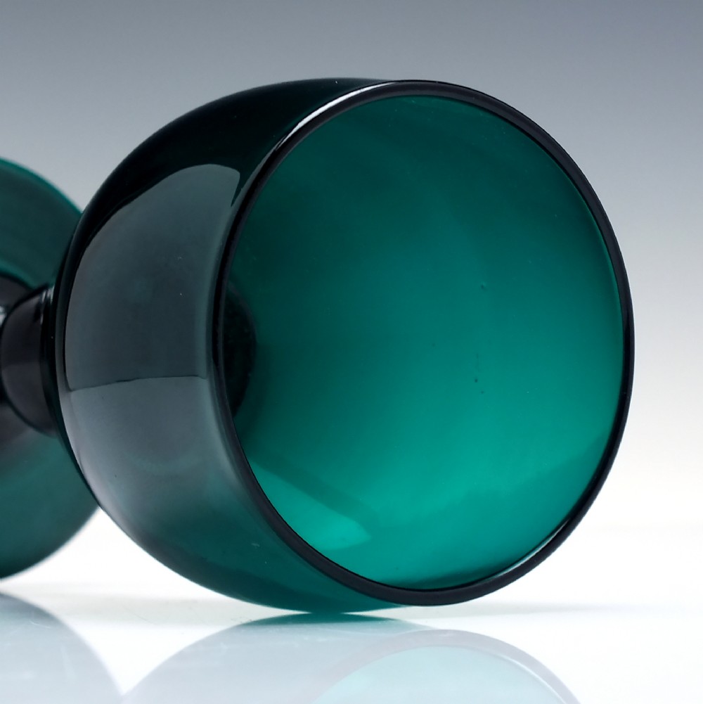 A pair of deep emerald green Georgian hand-blown wine glasses featuring curved bucket bowls, knopped stems, and circular flat bases. View V