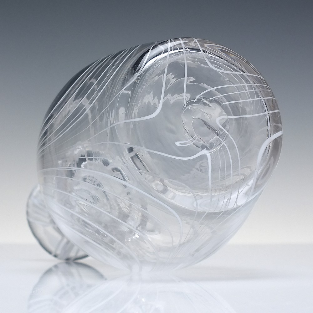 A clear lead glass Regency Prussian-shaped personal spirit decanter decorated with combed opaque white trailing and fitted with a matching glass stopper. View VIII