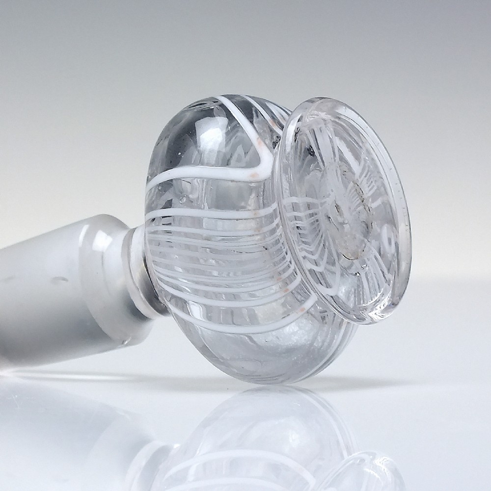 A clear lead glass Regency Prussian-shaped personal spirit decanter decorated with combed opaque white trailing and fitted with a matching glass stopper. View IX