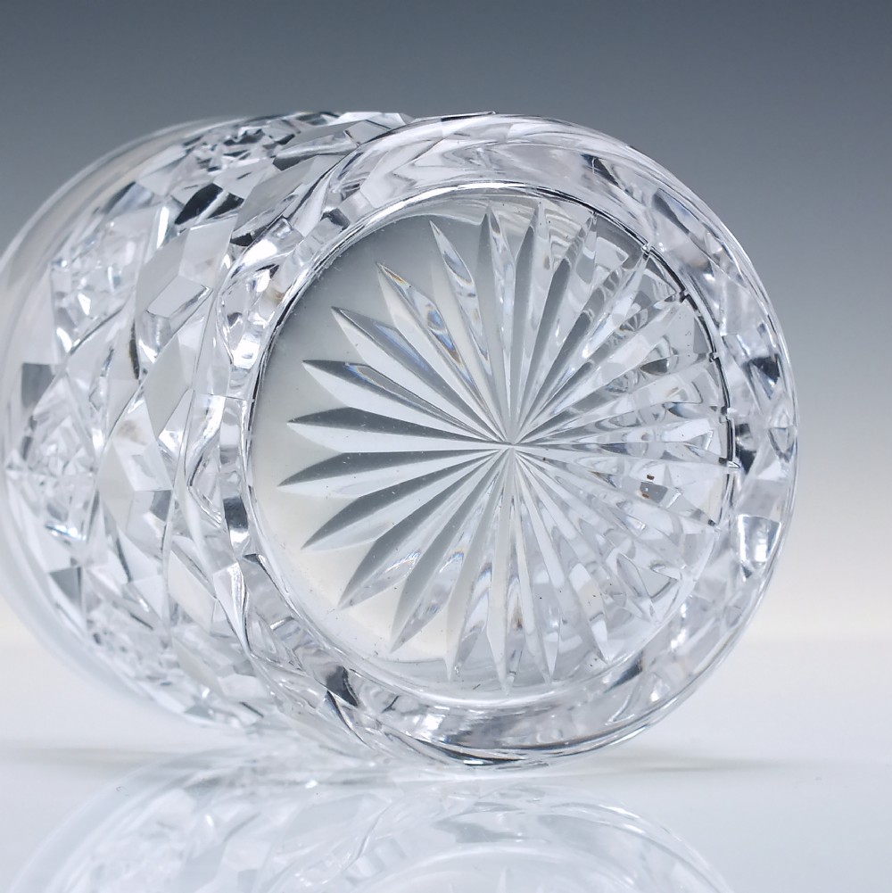 A pair of clear cut-crystal whisky tumblers featuring a deep diamond geometric pattern and smooth polished rims. View V