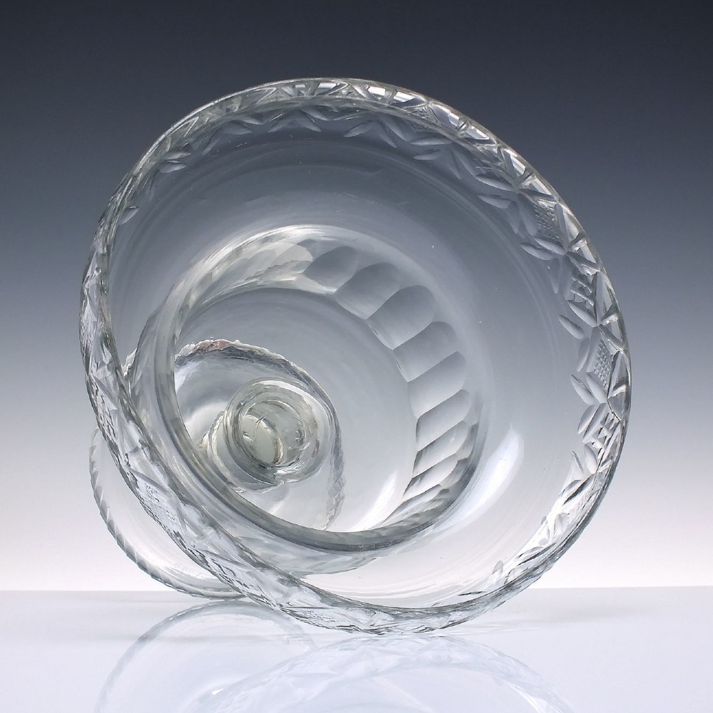 A clear Georgian cut glass standing bowl featuring a wide diamond-cut rim, fluted basin, knopped stem, and circular foot. View III