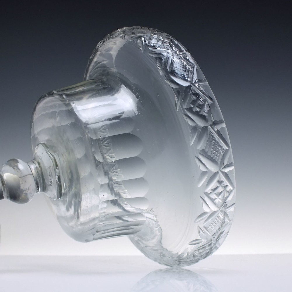 A clear Georgian cut glass standing bowl featuring a wide diamond-cut rim, fluted basin, knopped stem, and circular foot. View IV