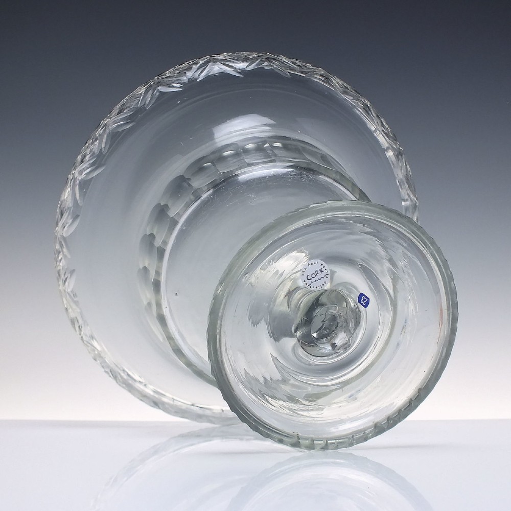 A clear Georgian cut glass standing bowl featuring a wide diamond-cut rim, fluted basin, knopped stem, and circular foot. View V