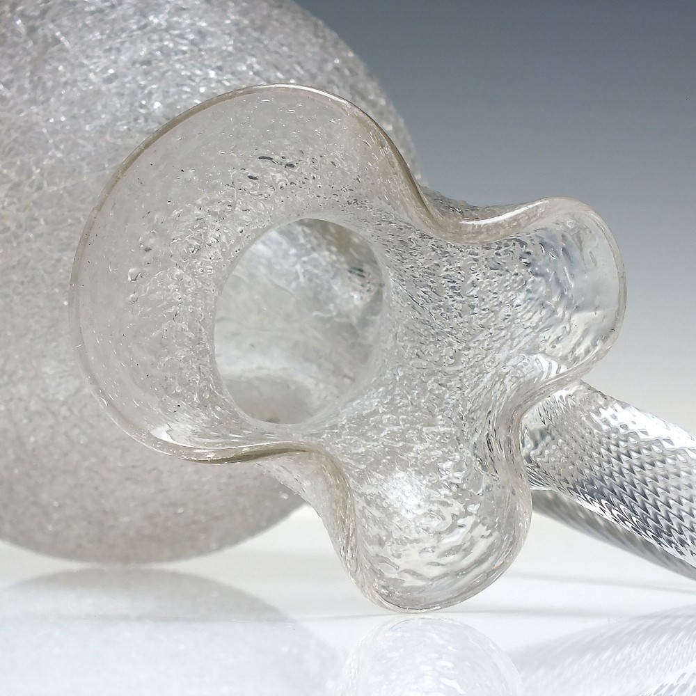 A late 19th-century Victorian clear overshot glass champagne jug with a textured ice-glass surface, flared spout, and an applied ribbed clear handle. View IV
