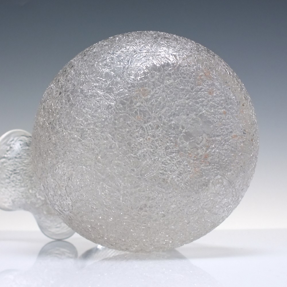 A late 19th-century Victorian clear overshot glass champagne jug with a textured ice-glass surface, flared spout, and an applied ribbed clear handle. View VI