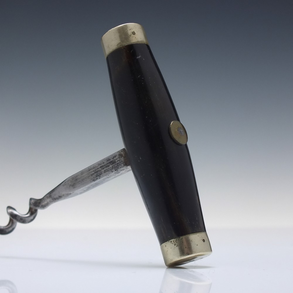 A Victorian direct-pull corkscrew featuring a T-bar handle made of dark polished horn capped with silver-plated ends and a steel helix worm. View II