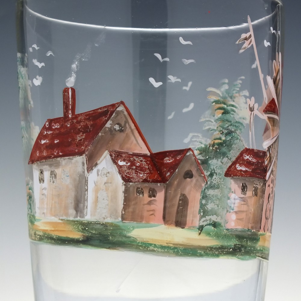 A clear glass tumbler featuring a hand-painted enamel illustration of a windmill and rural cottage. View III