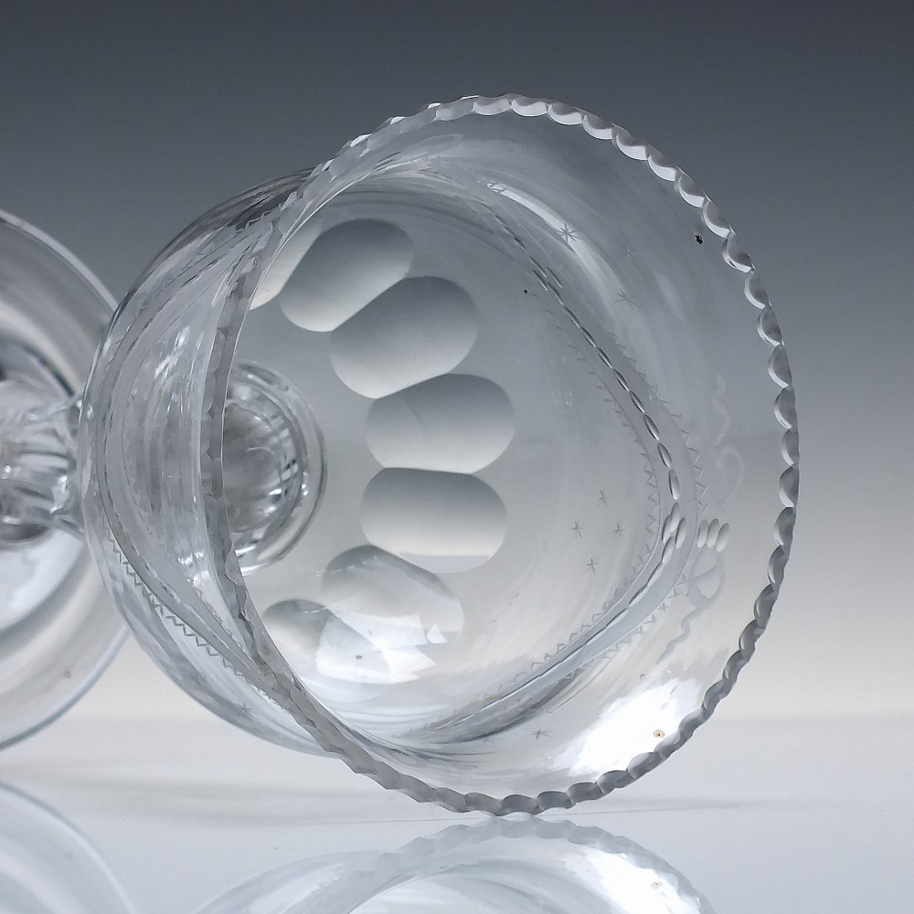 An 18th-century Georgian clear glass sweetmeat vessel featuring a wheel-engraved rim, faceted pedestal stem, and domed circular foot. View VI