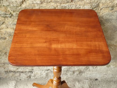 A square top antique fruitwood wine table featuring rounded corners, a central turned baluster stem, and three splayed tripod legs. View IV
