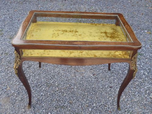 A mid-19th century French kingwood bijouterie table featuring glazed glass panels, gilt-bronze ormolu mounts, and cabriole legs. View II