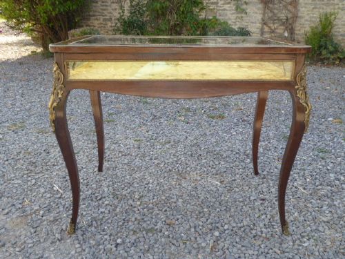 A mid-19th century French kingwood bijouterie table featuring glazed glass panels, gilt-bronze ormolu mounts, and cabriole legs. View III