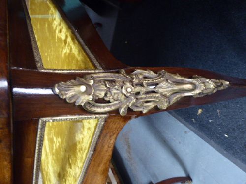 A mid-19th century French kingwood bijouterie table featuring glazed glass panels, gilt-bronze ormolu mounts, and cabriole legs. View V