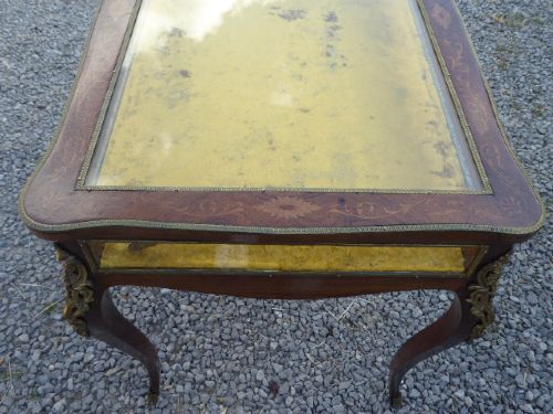 A mid-19th century French kingwood bijouterie table featuring glazed glass panels, gilt-bronze ormolu mounts, and cabriole legs. View VIII