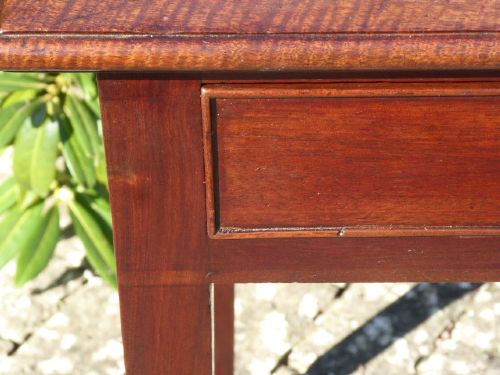 A Georgian mahogany side table featuring a single drawer with a central brass handle and slender square tapered legs. View V
