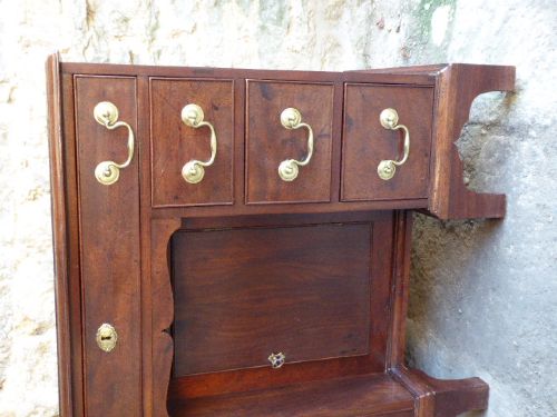 An antique Georgian mahogany kneehole desk featuring brass swan-neck handles, a central recessed cupboard, and bracket feet. View IV