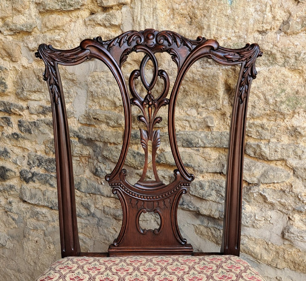 A mid-19th-century mahogany Chippendale style side chair featuring a carved pierced splat back, patterned upholstery, and cabriole front legs with ball-and-claw feet. View III