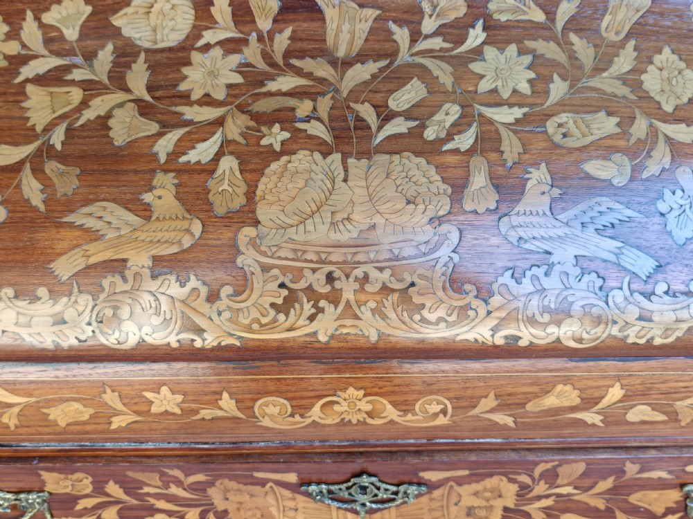 An antique Dutch mahogany writing bureau with intricate floral wood marquetry, a sloped fall front, a single drawer, and cabriole legs. View V