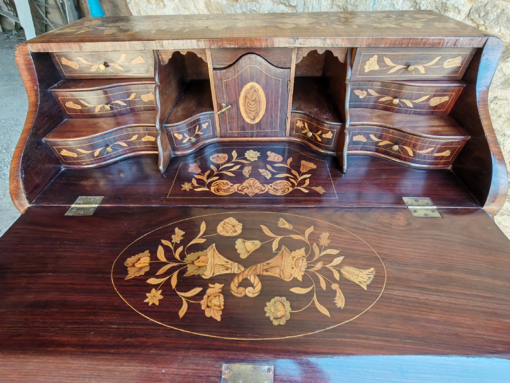 An antique Dutch mahogany writing bureau with intricate floral wood marquetry, a sloped fall front, a single drawer, and cabriole legs. View X