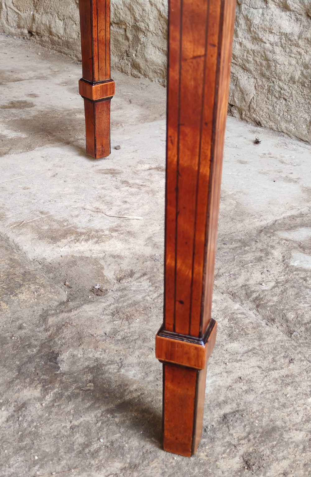 A late eighteenth-century Georgian satinwood demi-lune card table featuring inlaid crossbanding and four square tapered legs. View VII
