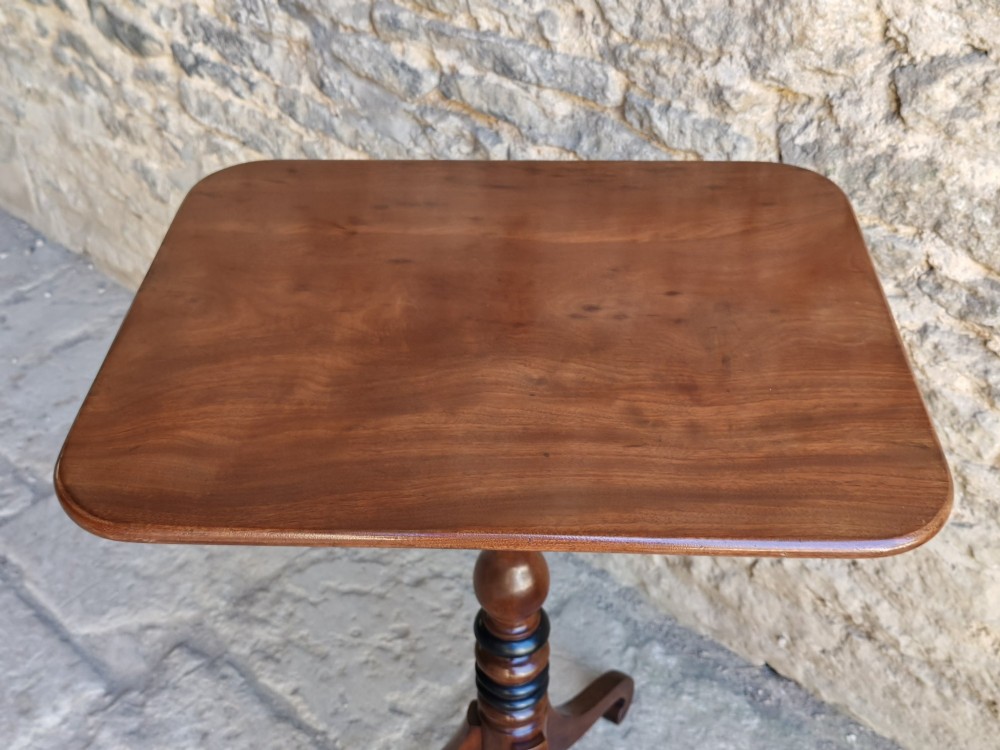 A Regency yew wood tripod table featuring a rectangular top with rounded corners, a turned central column with ebonised rings, and three splayed legs. View IV