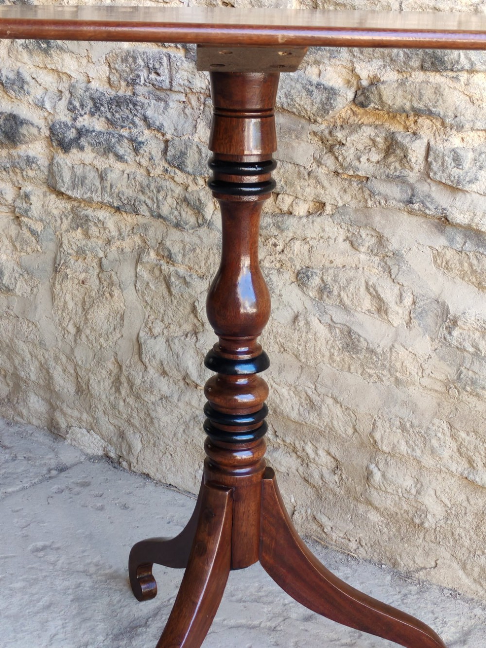 A Regency yew wood tripod table featuring a rectangular top with rounded corners, a turned central column with ebonised rings, and three splayed legs. View VI