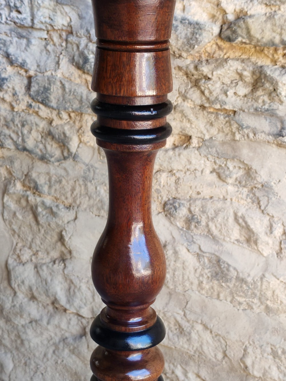 A Regency yew wood tripod table featuring a rectangular top with rounded corners, a turned central column with ebonised rings, and three splayed legs. View VII