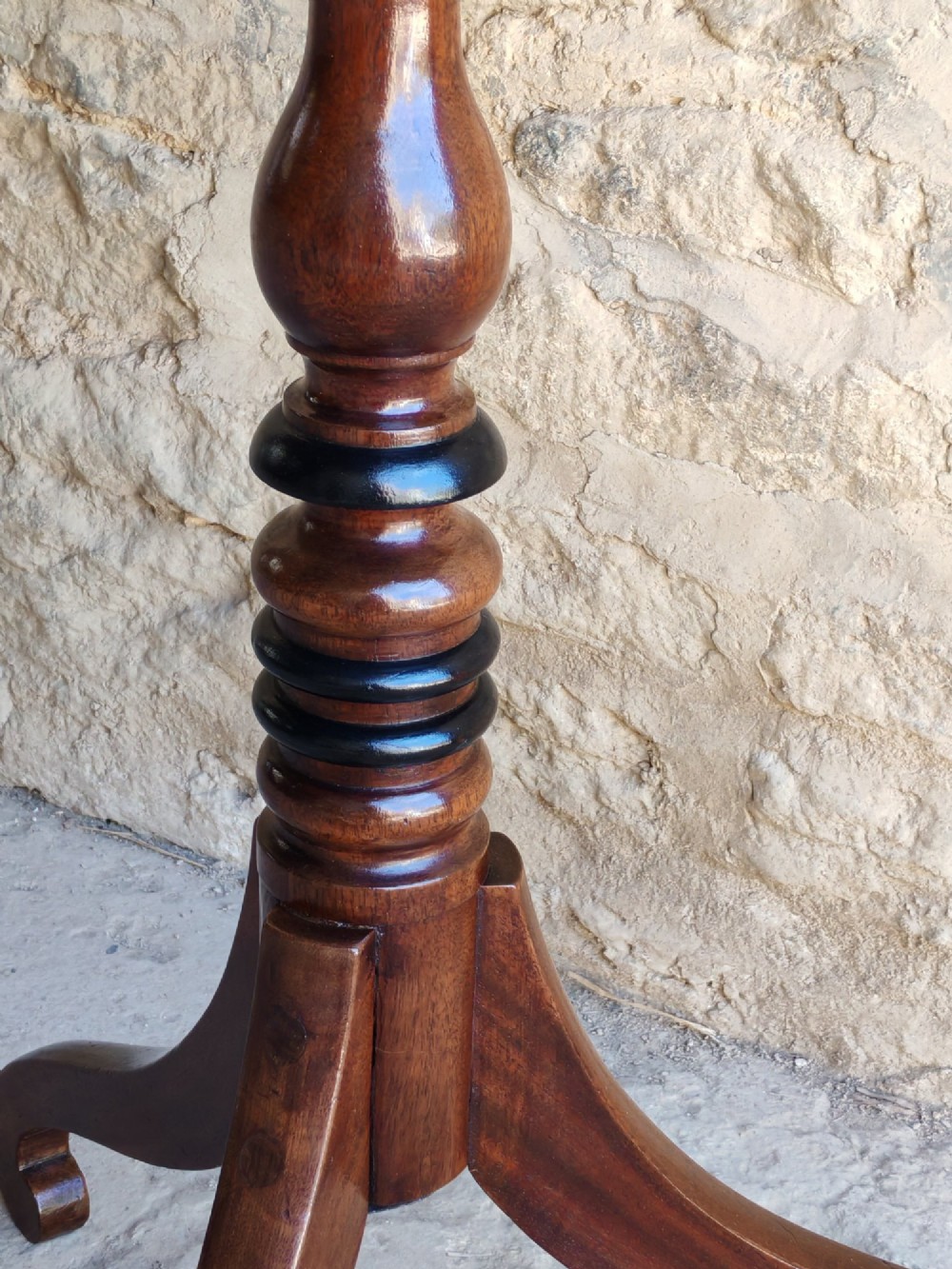 A Regency yew wood tripod table featuring a rectangular top with rounded corners, a turned central column with ebonised rings, and three splayed legs. View VIII