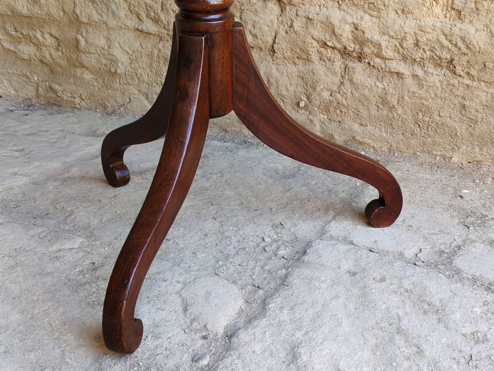 A Regency yew wood tripod table featuring a rectangular top with rounded corners, a turned central column with ebonised rings, and three splayed legs. View IX