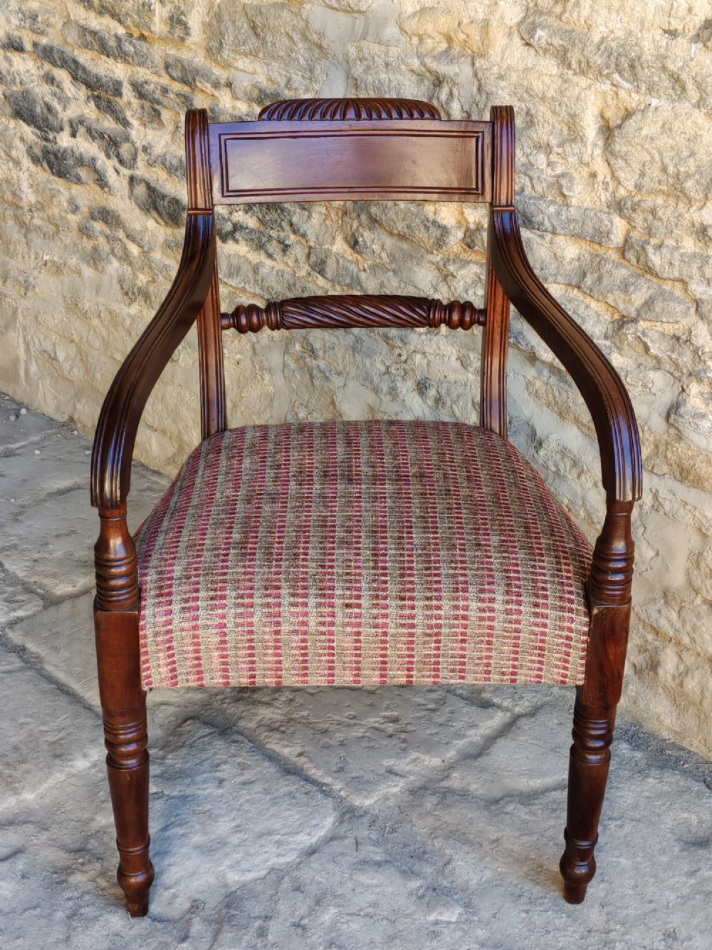 A Regency dark mahogany carver chair featuring a carved rope twist back rail, curved armrests, turned front legs, and a patterned woven upholstery seat. View II