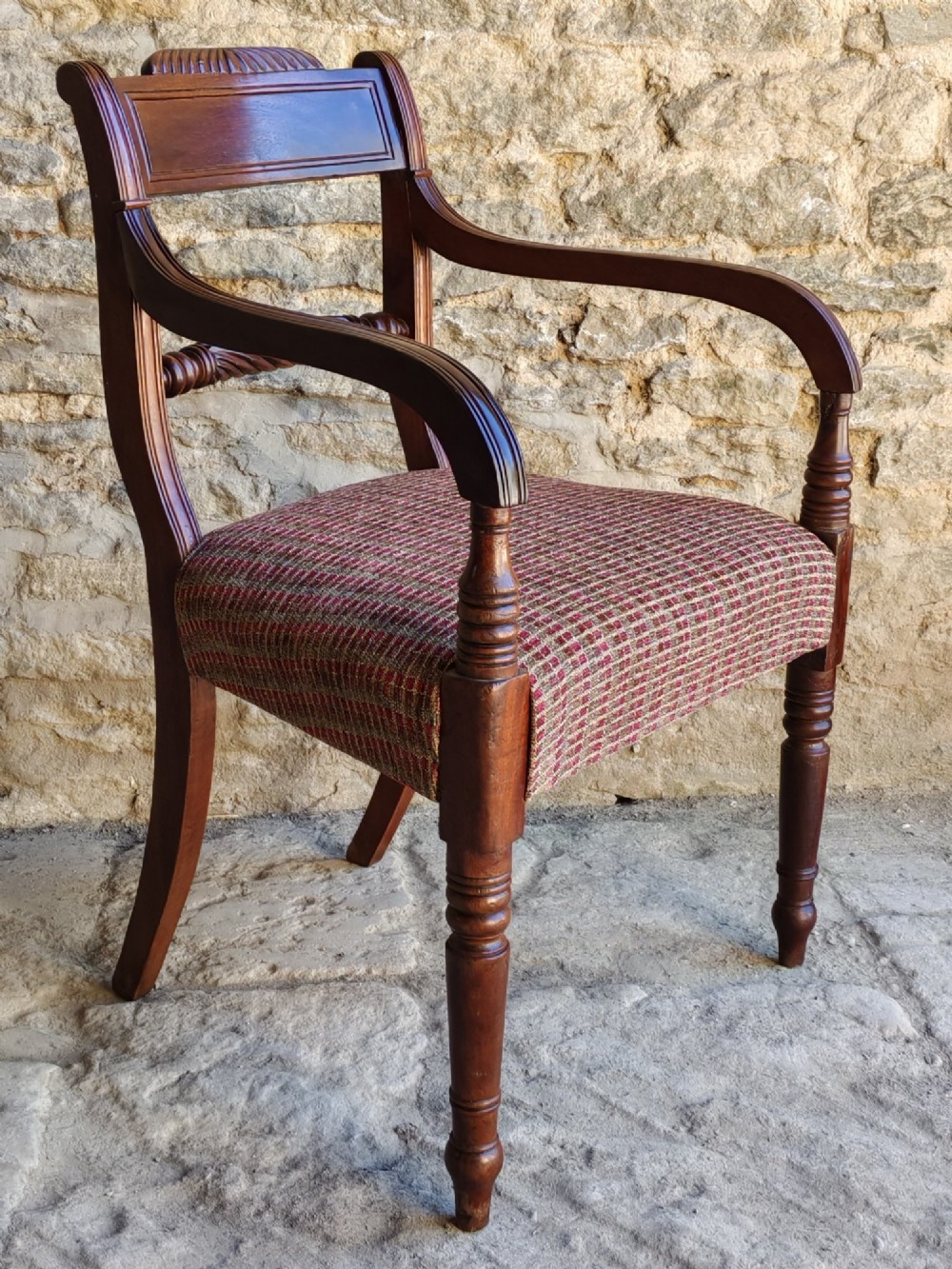 A Regency dark mahogany carver chair featuring a carved rope twist back rail, curved armrests, turned front legs, and a patterned woven upholstery seat. View III