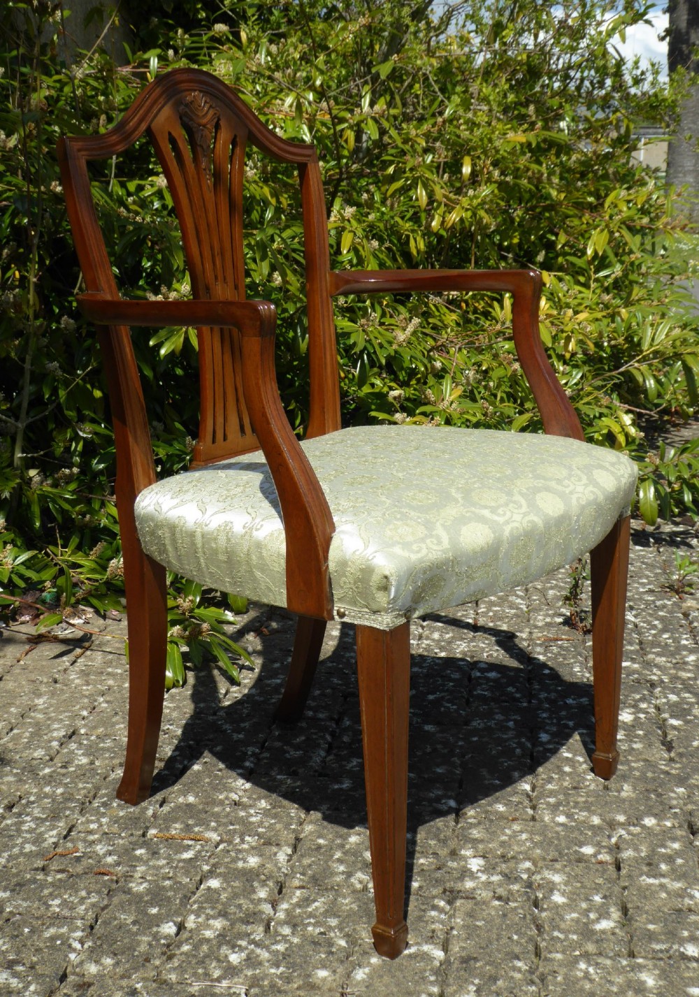 A set of six mahogany dining chairs featuring carved pierced back splats, tapered legs, and pale green patterned upholstery. View III