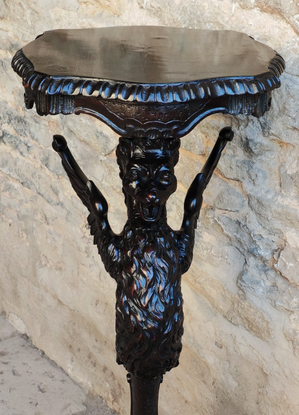 A nineteenth-century dark wood torchere stand featuring a hand-carved dragon support column and a molded circular top on a tripod base. View VII