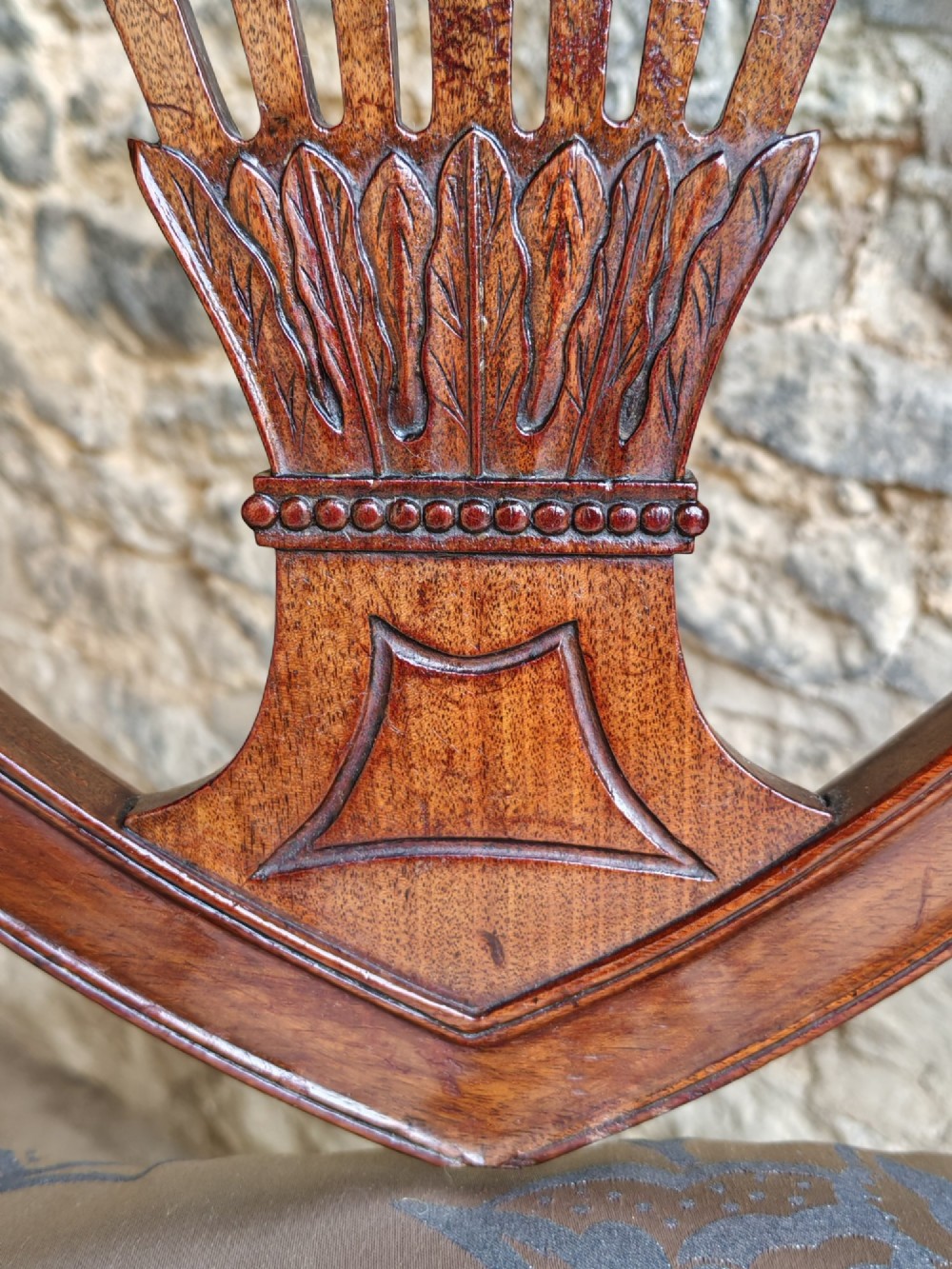 Set of four antique mahogany Hepplewhite dining chairs with carved shield backs and pattern upholstered seats. View VII