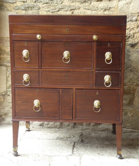 An eighteenth-century mahogany campaign chest with an open top lid, side brass handles, and an extended writing slope lined with green baize. View VII