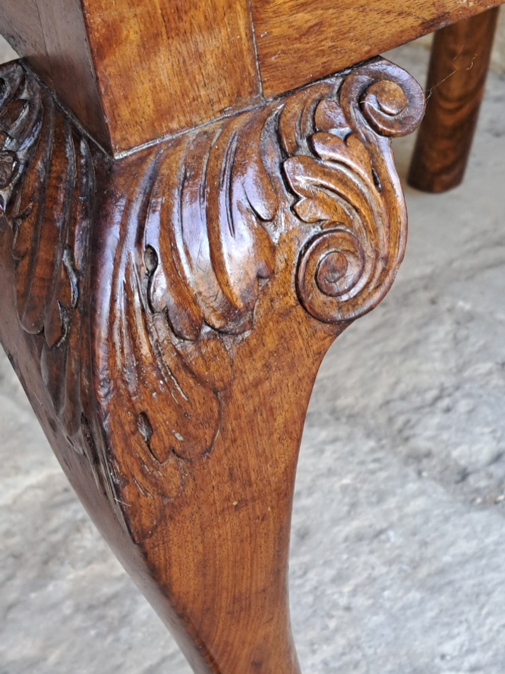 A 19th-century walnut side chair featuring an intricately carved pierced back splat, cabriole legs with carved knees, and a patterned upholstered seat. View IX