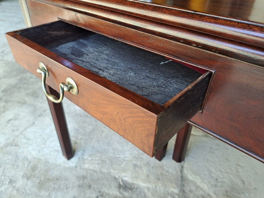 An 18th-century Georgian Cuban mahogany tea table featuring a rectangular foldover top, a single drawer with a brass handle, and straight moulded legs. View VIII