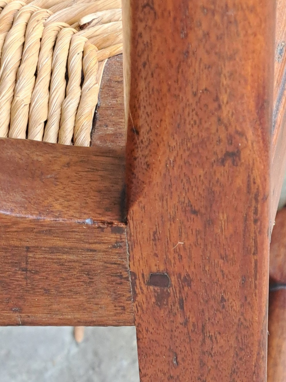 A Queen Anne walnut side chair featuring a solid vase-shaped back splat, a woven rush seat, cabriole front legs with pad feet, and turned stretchers. View VIII