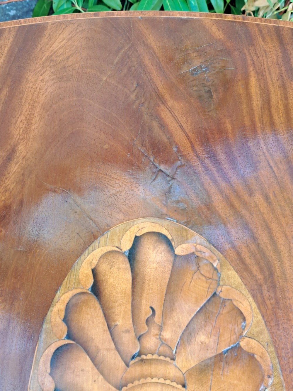 A George III mahogany drop-leaf Pembroke table featuring an oval satinwood shell inlay medallion, drawer with brass ring handles, and square tapered legs on brass castors. View VII