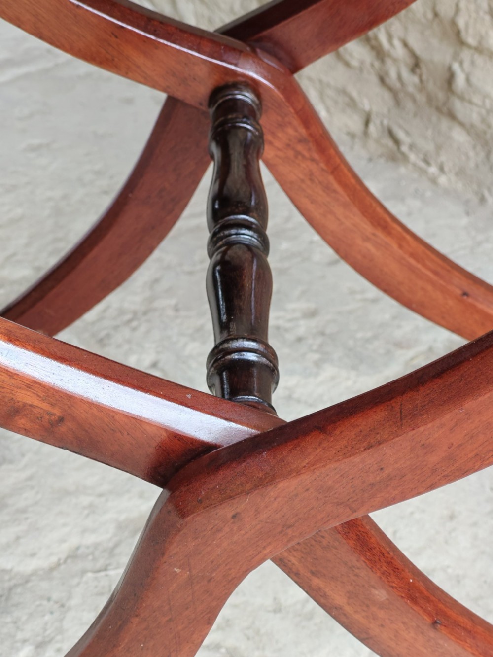 An Edwardian mahogany coaching table featuring a hinged folding rectangular top supported by curved X-frame legs and turned stretchers. View VI