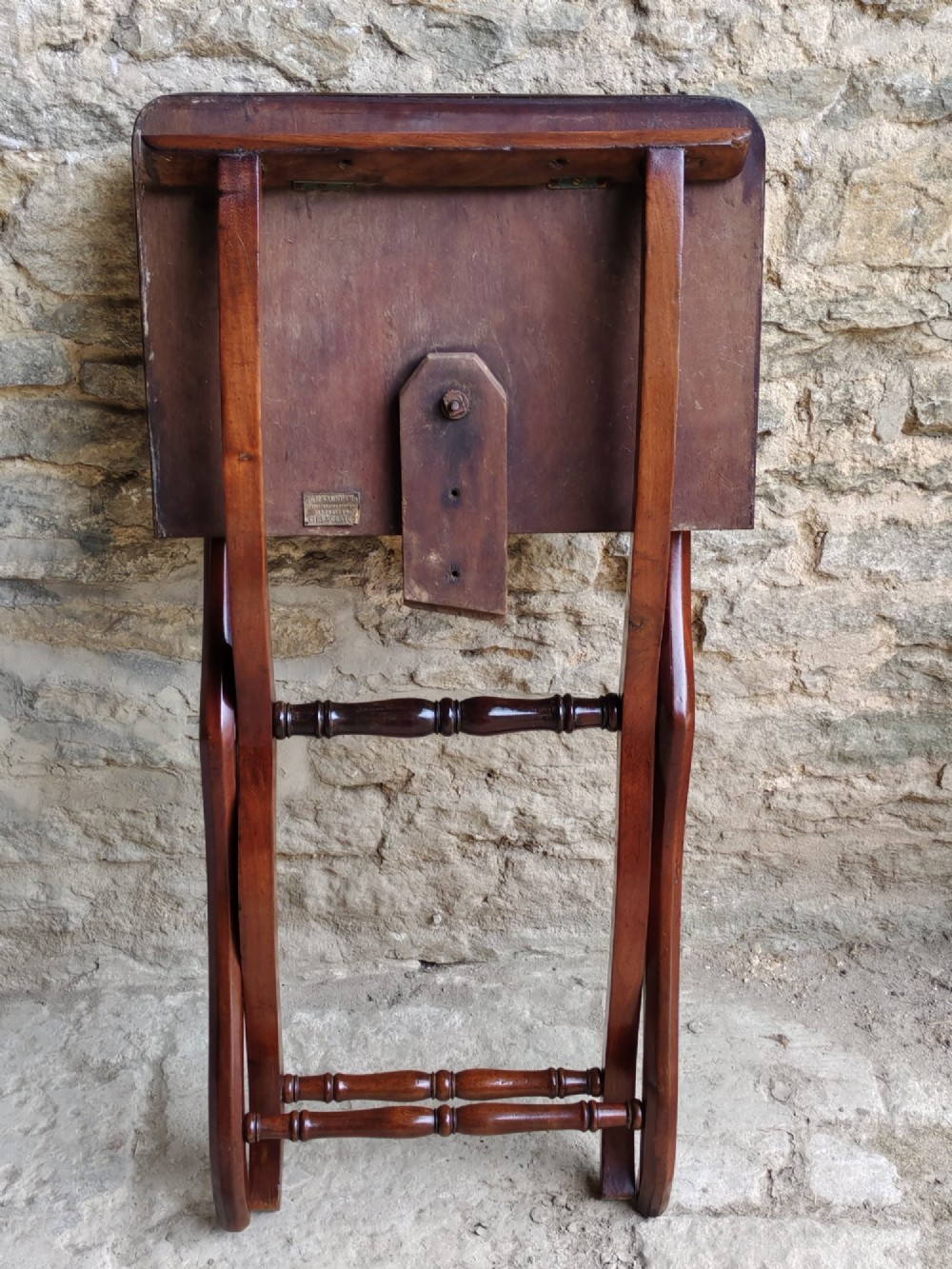 An Edwardian mahogany coaching table featuring a hinged folding rectangular top supported by curved X-frame legs and turned stretchers. View VII