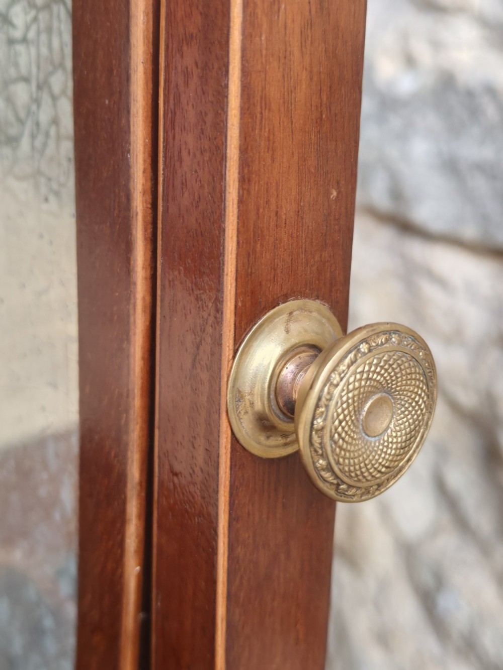 A Georgian mahogany dressing mirror featuring a shield-shaped swivel frame, bone finials, and an inlaid three-drawer box base. View IX