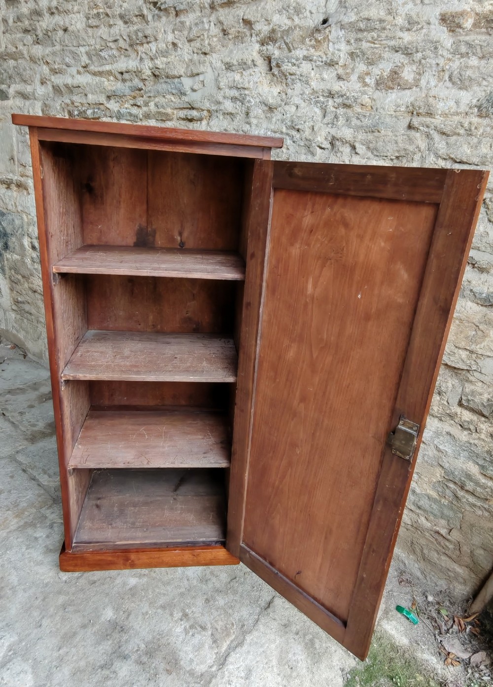 A tall mahogany single-door cupboard featuring a prominent marquetry inlaid panel depicting a mountain landscape with tall trees and a central path. View VII