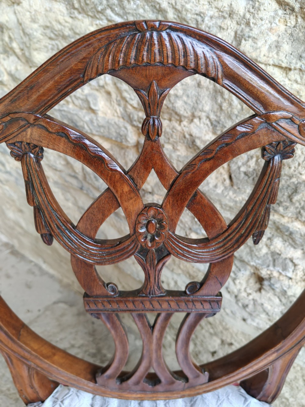A Georgian walnut side chair featuring a carved shield backrest with openwork detailing and a patterned upholstered seat. View VI