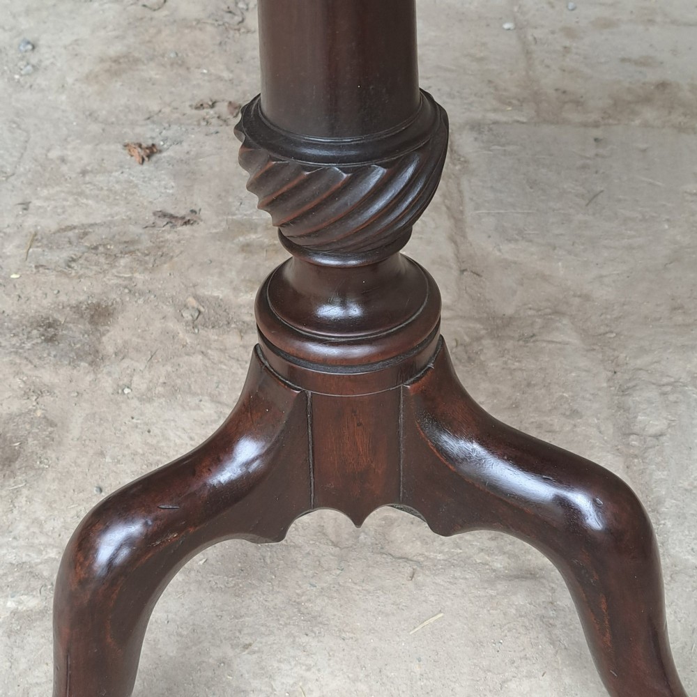 An 18th-century Georgian mahogany tilt-top table featuring a circular top, turned central column with a spirally carved knop, and three cabriole legs ending in pad feet. View II