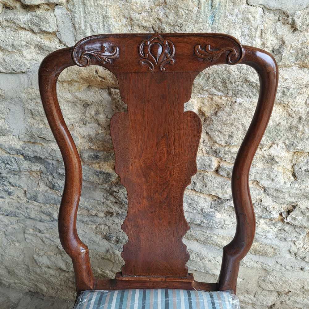 An 18th-century red walnut side chair with a shaped splat back, striped upholstered seat, and carved cabriole legs. View IV